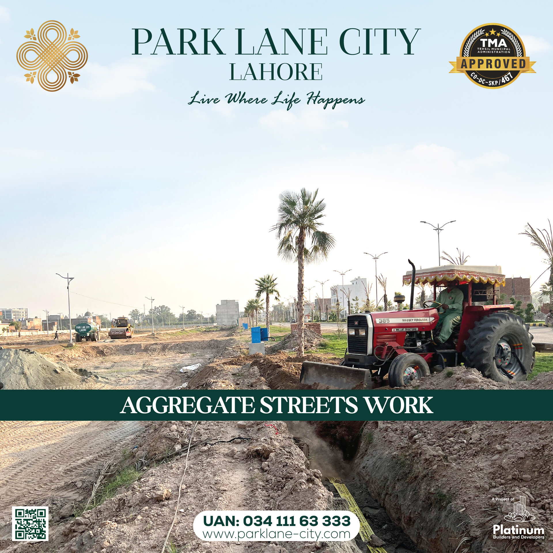 Tractor with aggregate work on main boulevard with palm trees visible