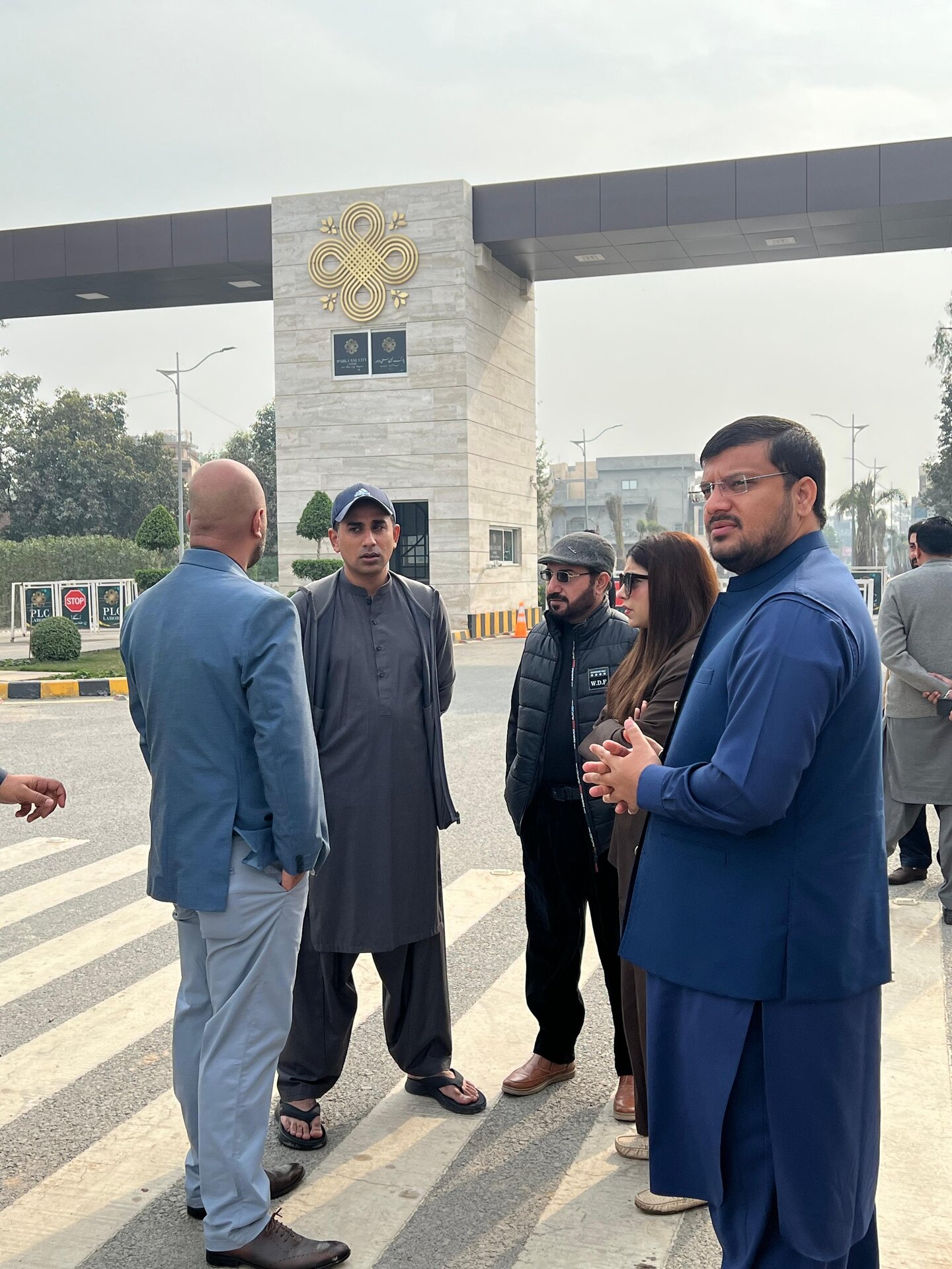 Park Lane City management team standing and discussing at Phase 2 main gate