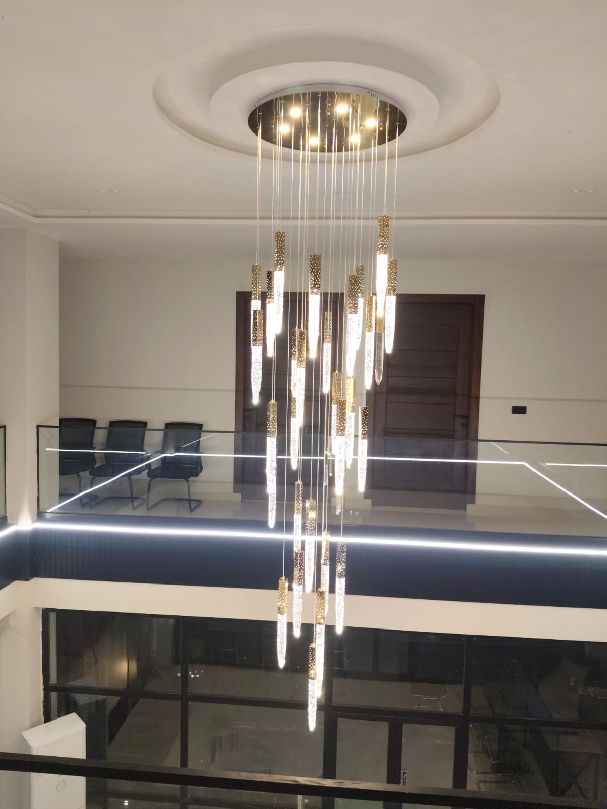 Park Lane City head office interior — grand double-height atrium with chandelier